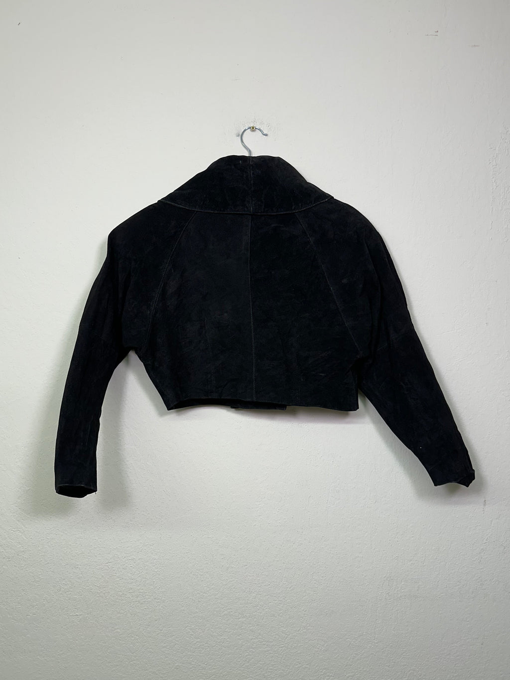 Black suede western jacket on a white background